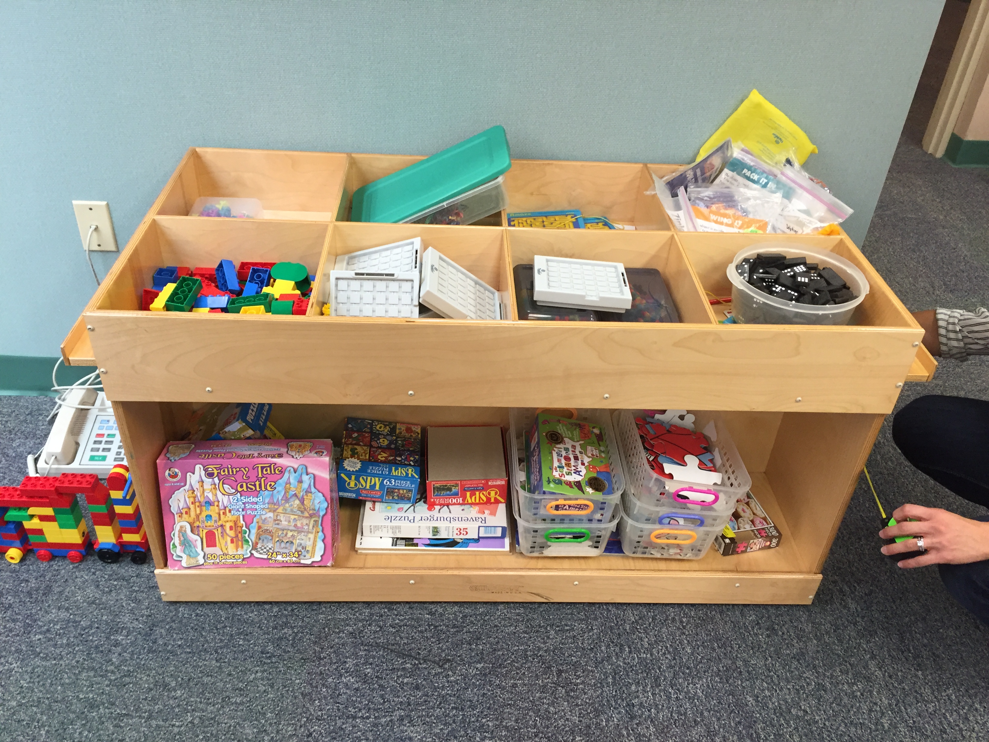 a table full of various games, some full sets, others missing pieces