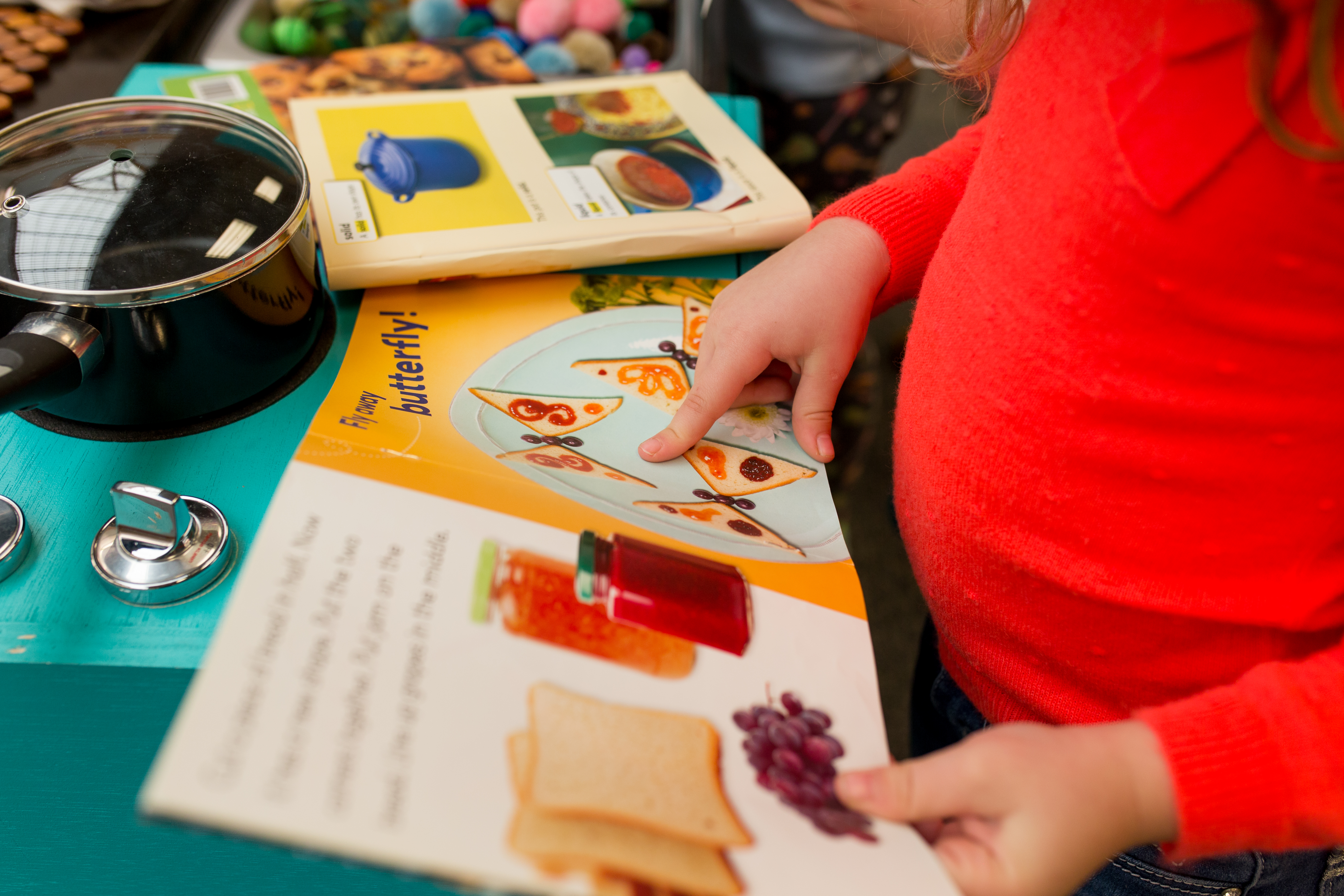 child reading a recipe book